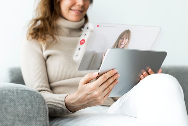 Woman using tablet for video call