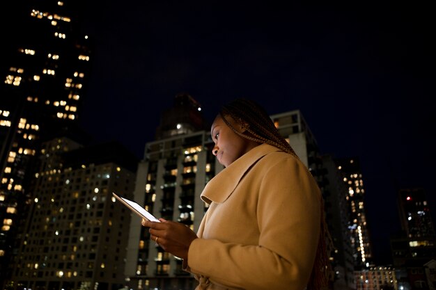 Woman using a tablet to work outdoors