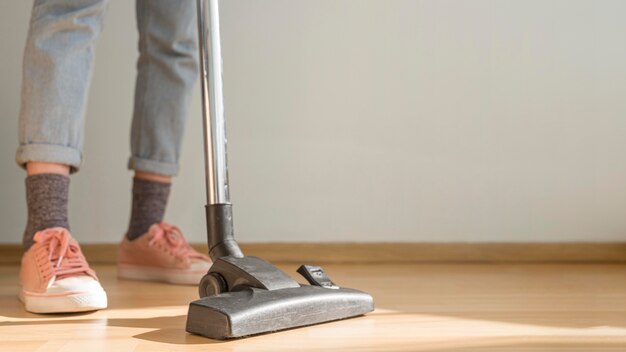 Woman using vacuum cleaner