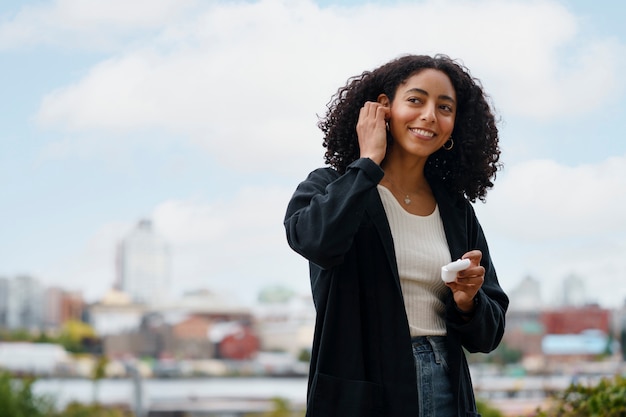 Woman using wireless headphone technology