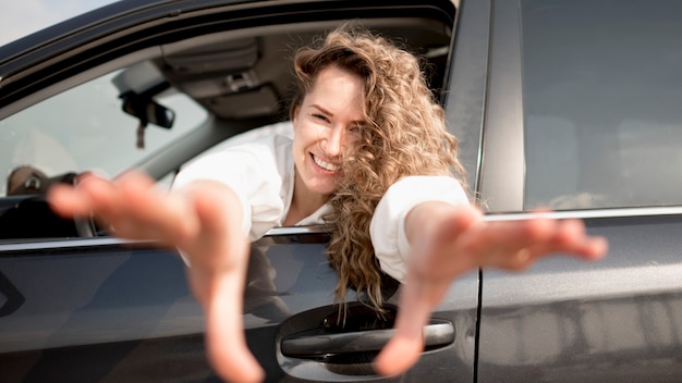 Woman in a vehicle smiling