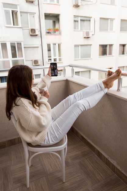 Woman video calling friends in quarantine