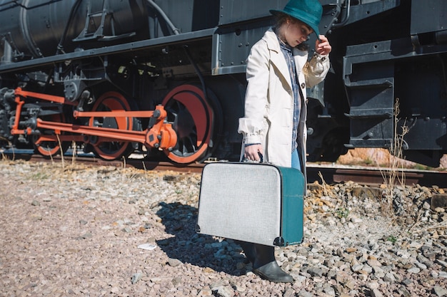 Woman in vintage clothes at train