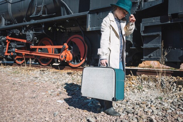 Woman in vintage clothes at train