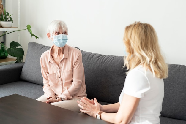 Free photo woman vising her older relative at nursing home