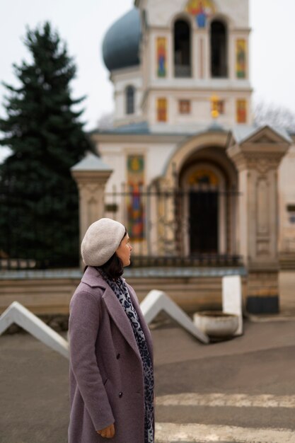Woman visiting church for religious pilgrimage