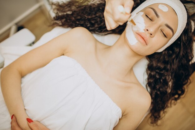 Woman visiting cosmetologist and making rejuvenation procedures