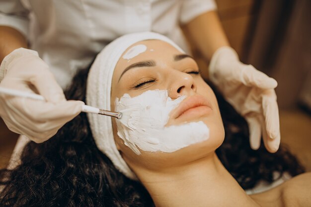 Woman visiting cosmetologist and making rejuvenation procedures