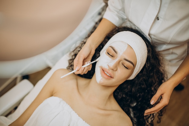 Woman visiting cosmetologist and making rejuvenation procedures