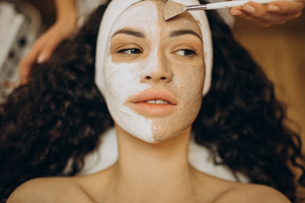 Woman visiting cosmetologist and making rejuvenation procedures