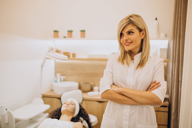 Woman visiting cosmetologist and making rejuvenation procedures