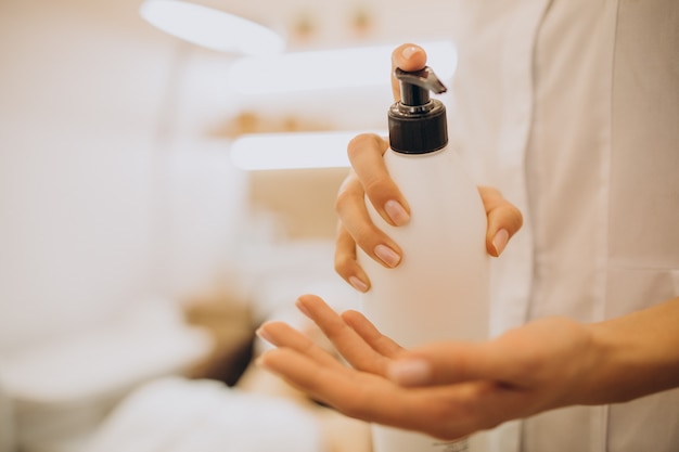 Woman visiting cosmetologist and making rejuvenation procedures