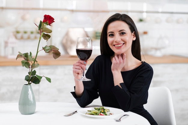 Woman waiting for her husband to take dinner together