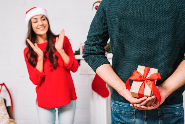 Woman waiting for present from man
