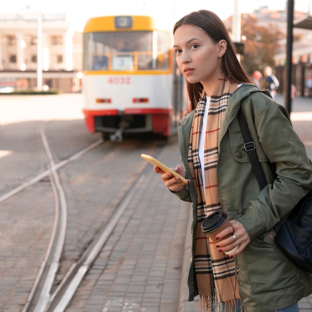 Woman waiting in the tramway station