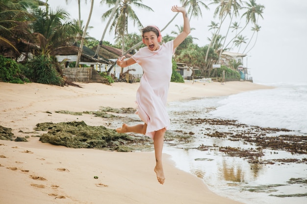 Woman walking on the beach sand