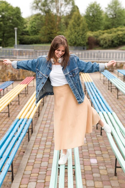 Woman walking on benches