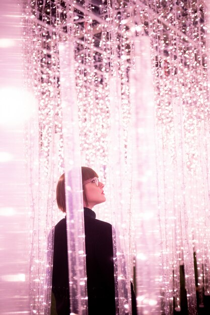 Woman walking in between light