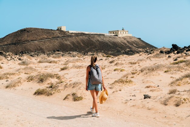 Woman walking on road in mountains