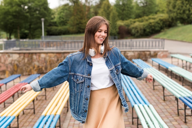 Woman walking through benches