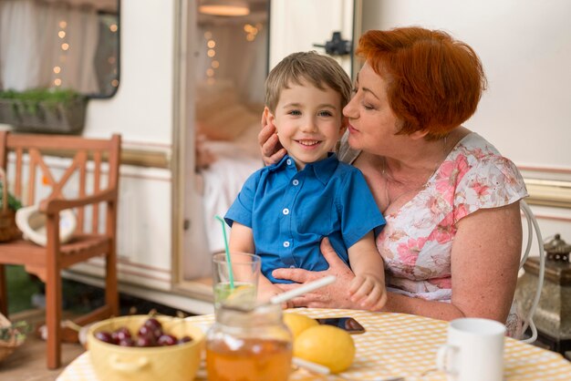 Woman wanting to kiss her grandson on the cheek