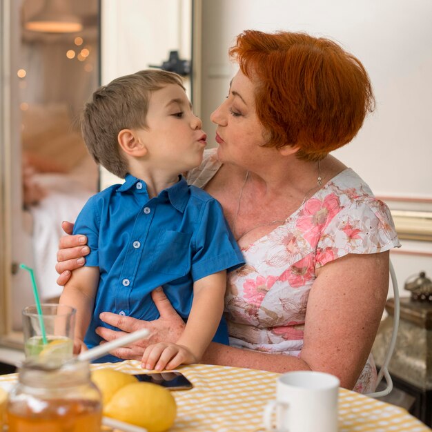 Woman wanting to kiss her grandson