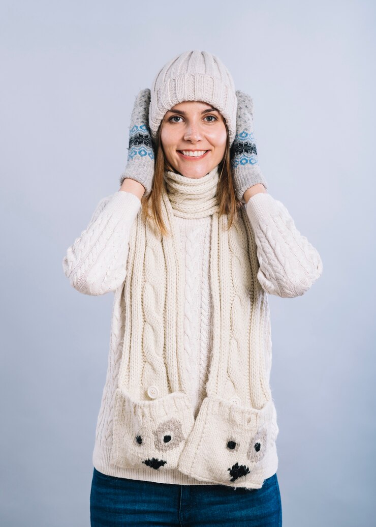 Free Photo woman in warm clothes covering ears 