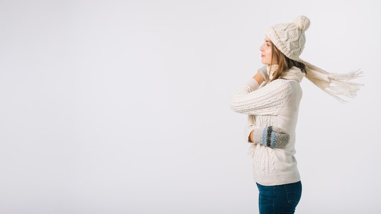 Free Photo woman in warm clothes on white background