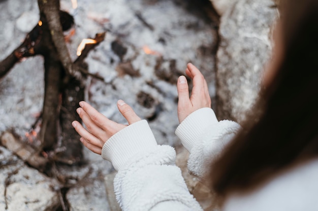 Woman warming up her hands