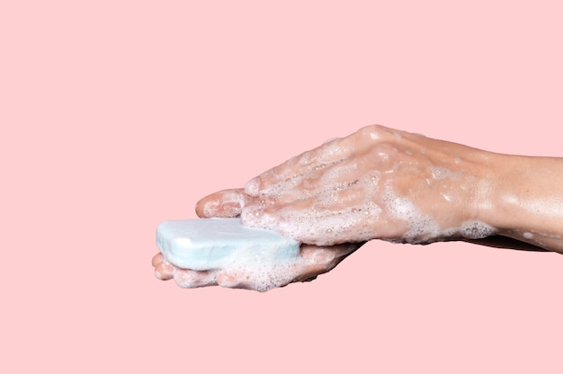 woman washing hands with a blue soap