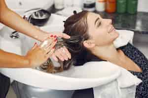 Free photo woman washing head in a hairsalon