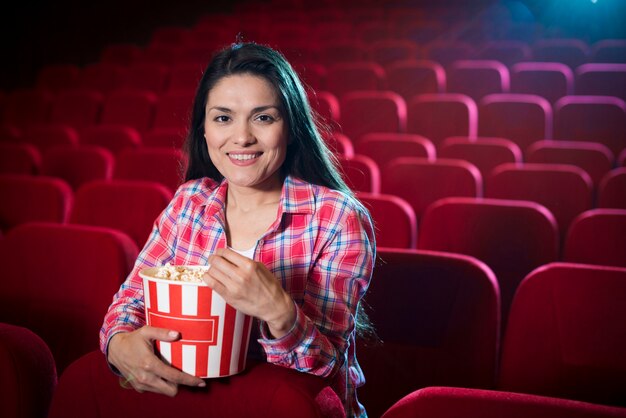 Woman watching movie in cinema