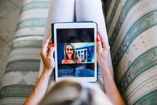 Woman watching photos on tablet