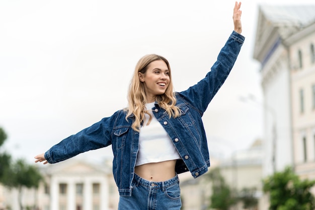 Woman waving her hands in the air