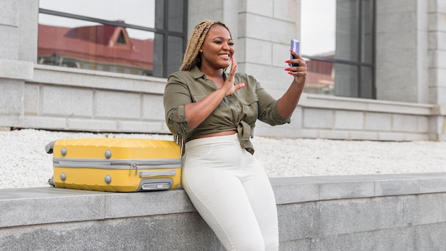 Woman waving while having a video call