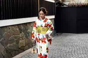 Free photo woman wearing beautiful japanese kimonos and obi