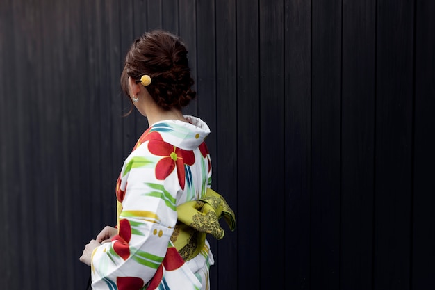 Free photo woman wearing beautiful japanese kimonos and obi