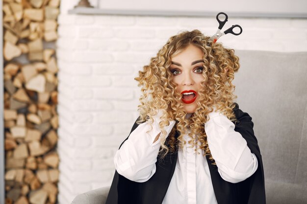 Woman wearing black costume. Lady with halloween makeup.