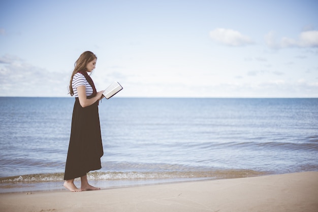 Free photo woman wearing black dress holding boo