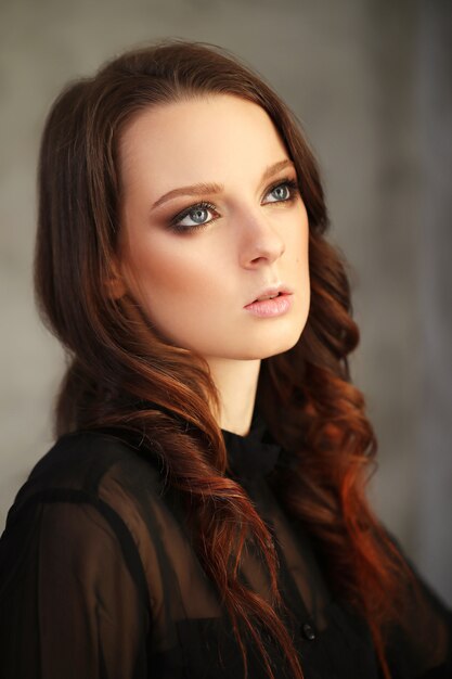 Woman wearing black mesh shirt