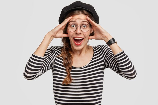 Woman wearing black stylish beret and striped blouse