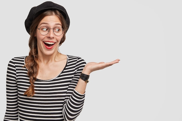 Woman wearing black stylish beret and striped blouse