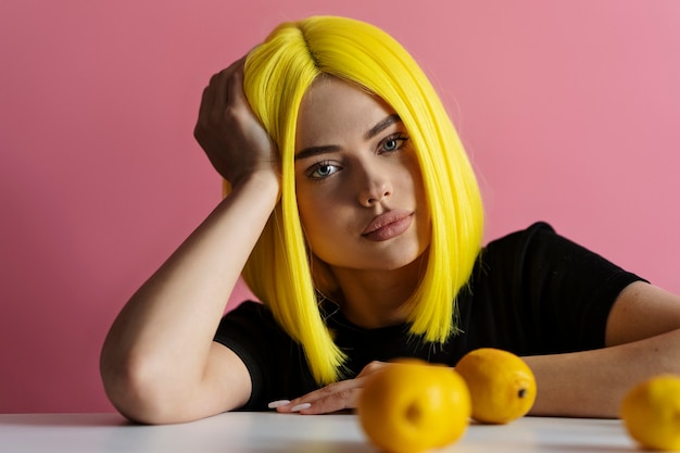 Free photo woman wearing blonde wig front view