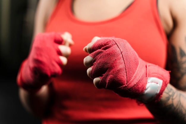 Woman wearing boxing gloves for training