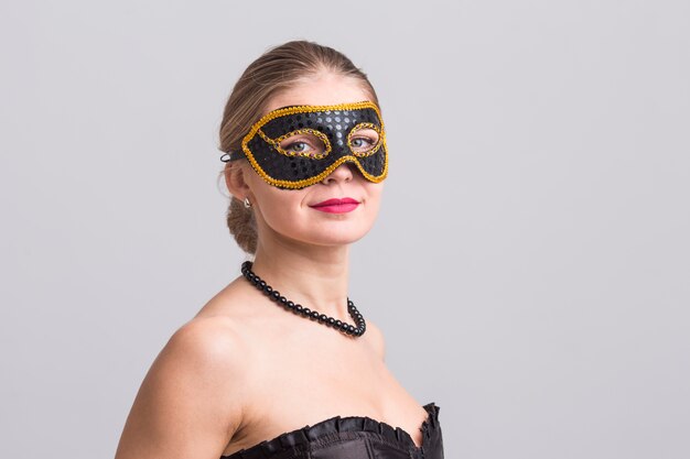 Woman wearing carnival mask