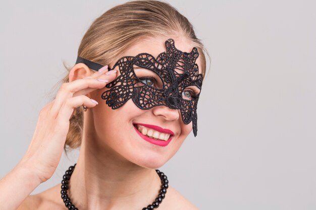 Woman wearing carnival mask