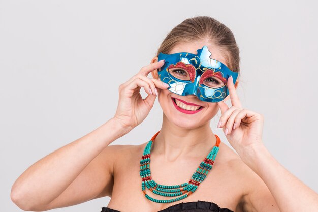 Woman wearing carnival mask