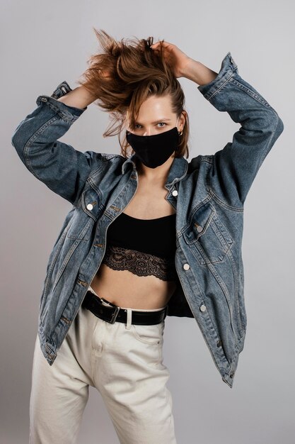 Woman wearing denim jacket and mask