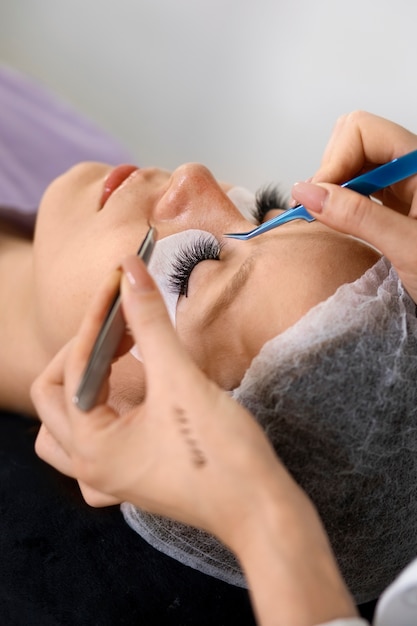 Woman wearing eye patches high angle