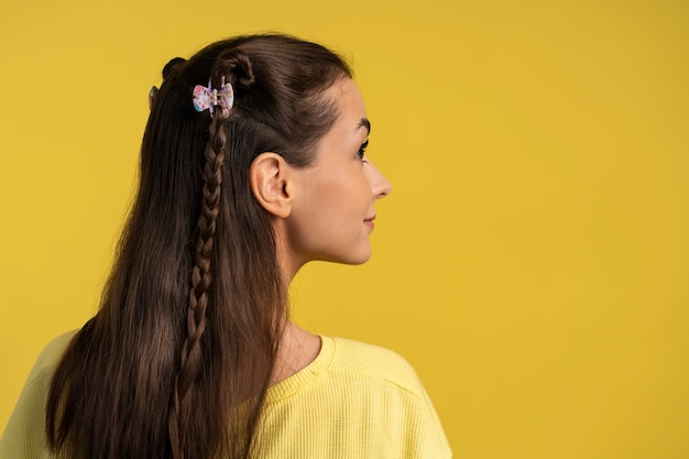 Free photo woman wearing hair clips side view